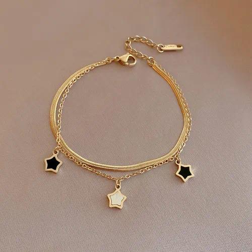 Pulsera doble dorada con estrellas negras*